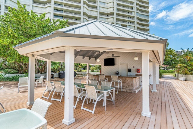 wooden terrace with a bar and a gazebo