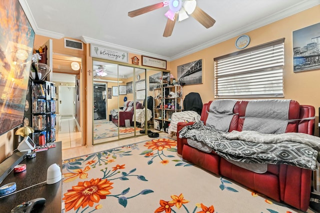 living room featuring ceiling fan and ornamental molding