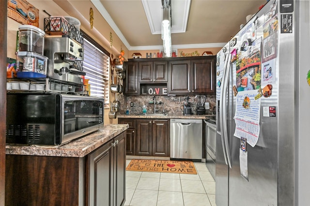 kitchen featuring sink, crown molding, dark brown cabinets, light tile patterned flooring, and appliances with stainless steel finishes