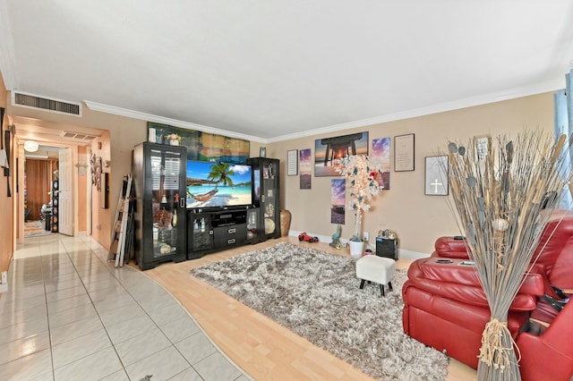 tiled living room featuring crown molding