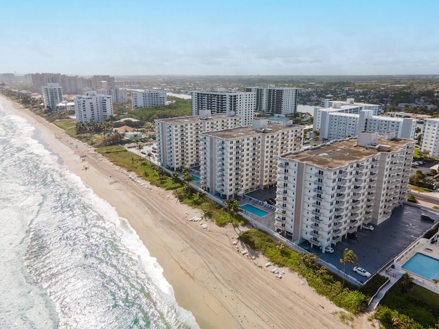 aerial view featuring a water view and a beach view