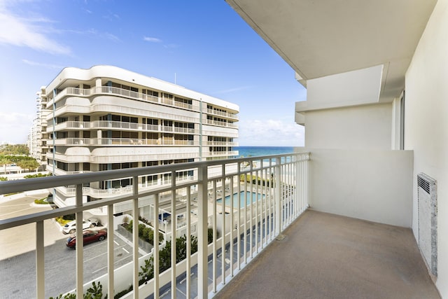 balcony featuring a water view