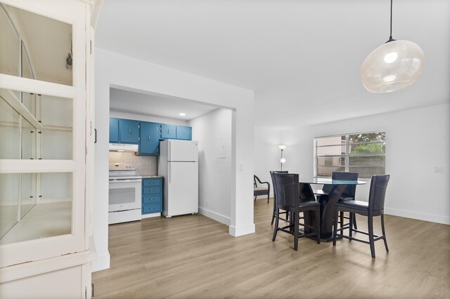 dining space with light hardwood / wood-style flooring