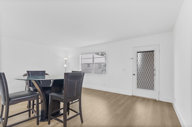 dining area with hardwood / wood-style floors