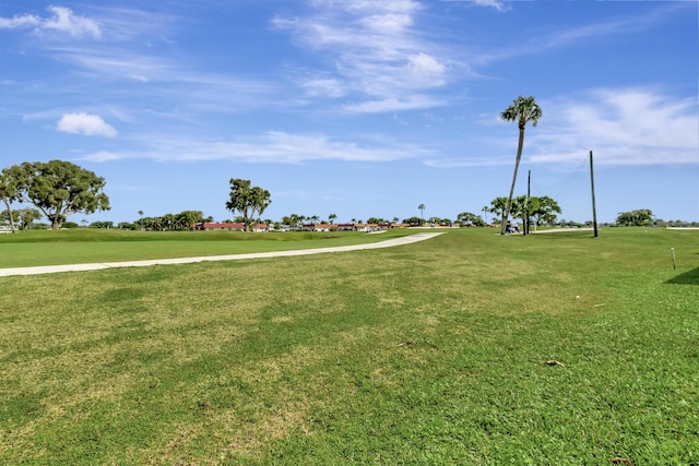 view of property's community with a lawn