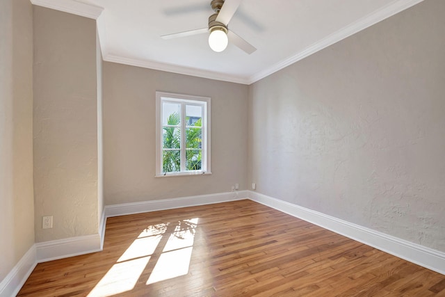 unfurnished room with ceiling fan, light hardwood / wood-style floors, and ornamental molding