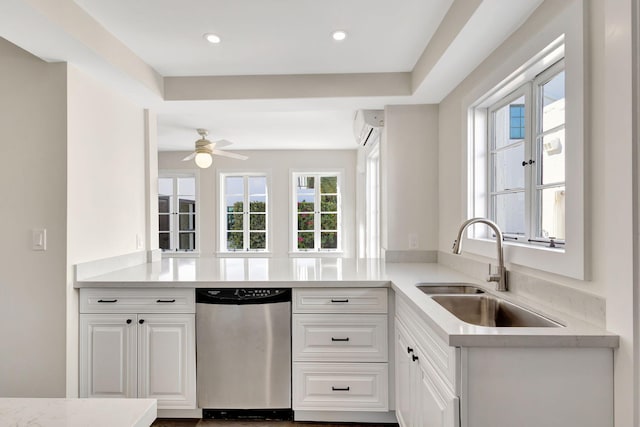 kitchen featuring dishwasher, plenty of natural light, white cabinets, and sink