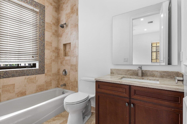 bathroom with visible vents, toilet, tile patterned flooring, bathtub / shower combination, and vanity