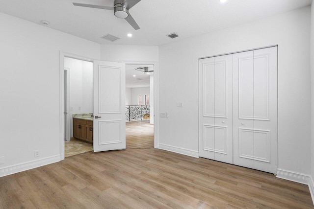 unfurnished bedroom with recessed lighting, a closet, visible vents, light wood-style floors, and baseboards