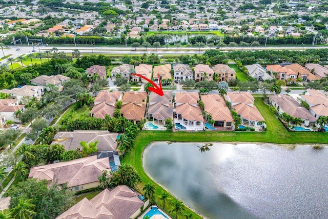 bird's eye view featuring a water view and a residential view