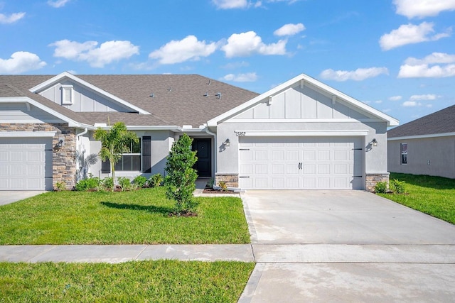 view of front of property featuring a front lawn and a garage