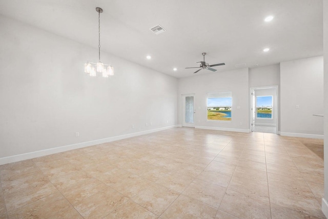 unfurnished living room with light tile patterned flooring and ceiling fan with notable chandelier