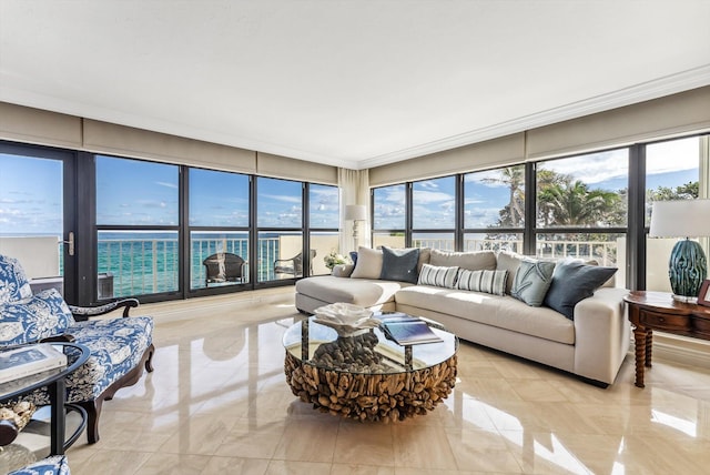 sunroom / solarium with a water view