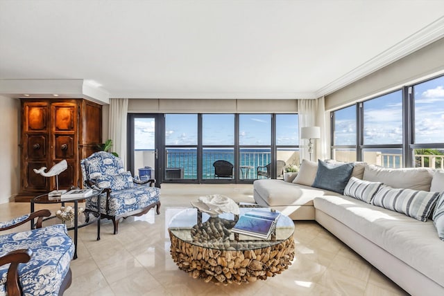 living room with a water view and crown molding