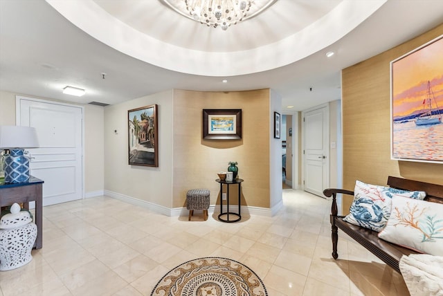 hall with a chandelier and light tile patterned flooring