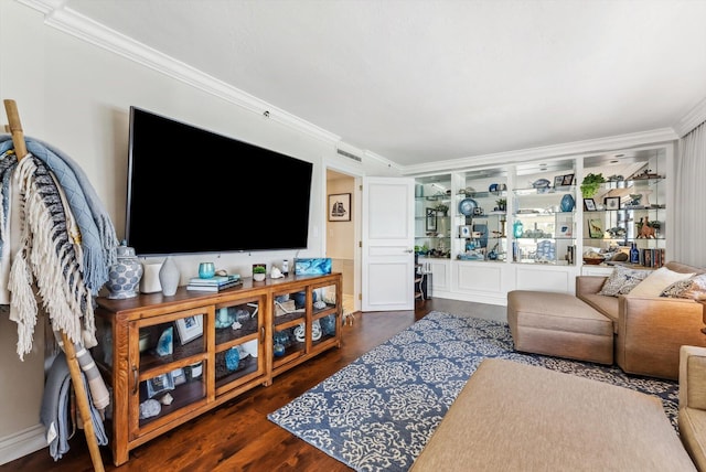 living room with dark hardwood / wood-style flooring and crown molding