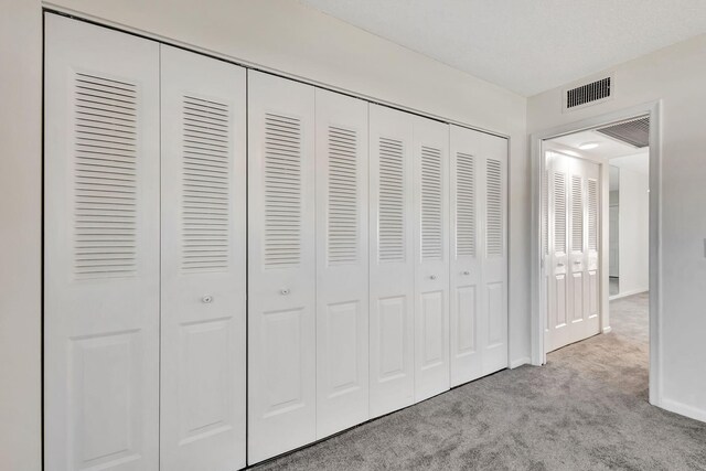 unfurnished bedroom featuring light colored carpet