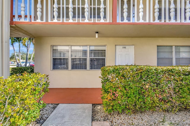 entrance to property with a balcony