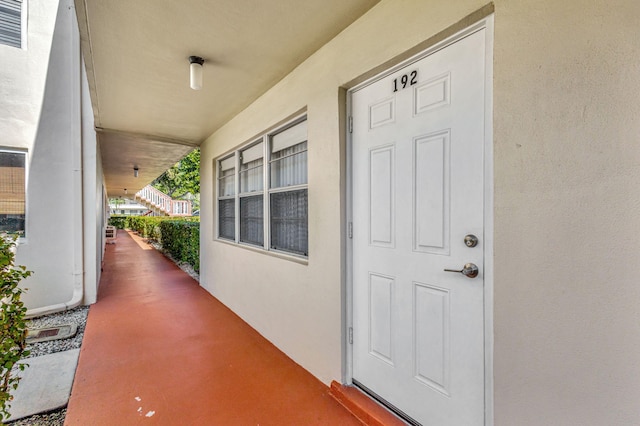 doorway to property with a porch