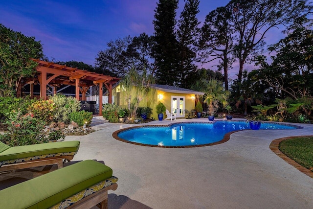 pool at dusk featuring a pergola and a patio