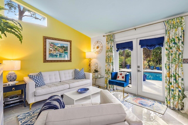 living room with french doors and vaulted ceiling