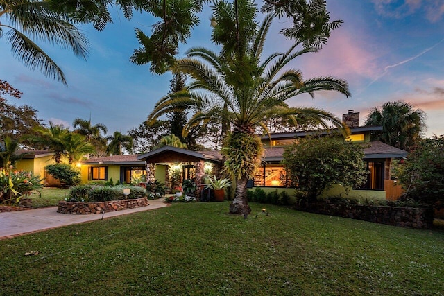 view of front of property with a yard