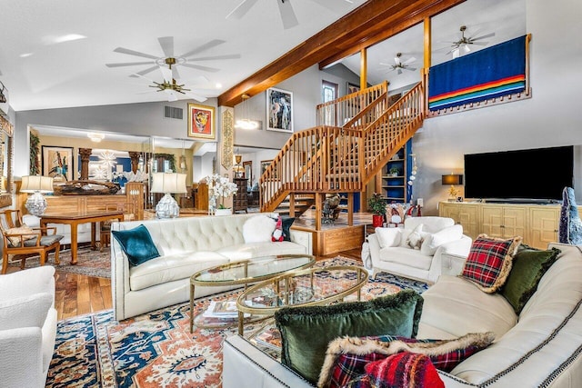 living room with hardwood / wood-style floors and vaulted ceiling with beams