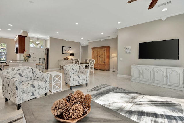 tiled living room with ceiling fan