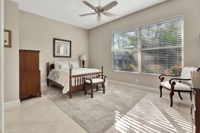 bedroom with ceiling fan and light tile patterned floors