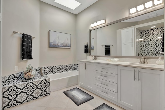 bathroom featuring vanity, a skylight, tile patterned floors, and independent shower and bath