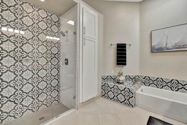 bathroom featuring tile patterned flooring and plus walk in shower