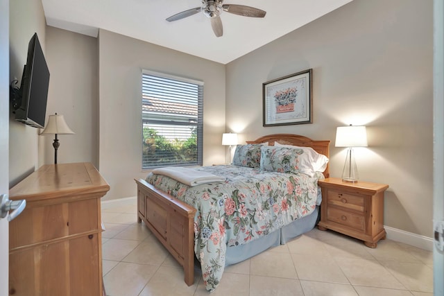 bedroom with ceiling fan and light tile patterned floors