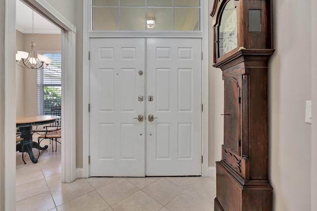 foyer featuring a notable chandelier and light tile patterned floors