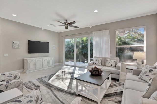 tiled living room featuring ceiling fan and ornamental molding