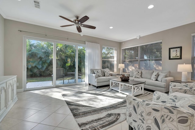 tiled living room with ceiling fan and ornamental molding