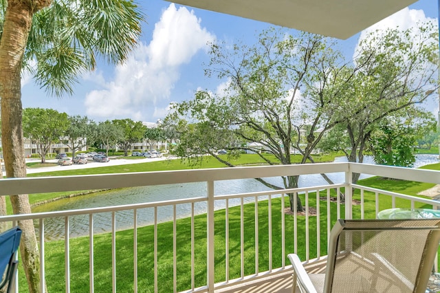 balcony featuring a water view