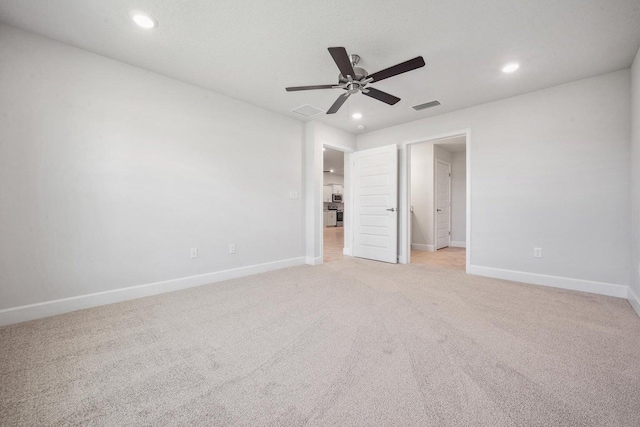 unfurnished bedroom with ceiling fan and light carpet