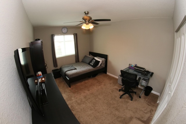 bedroom featuring carpet flooring, vaulted ceiling, and ceiling fan