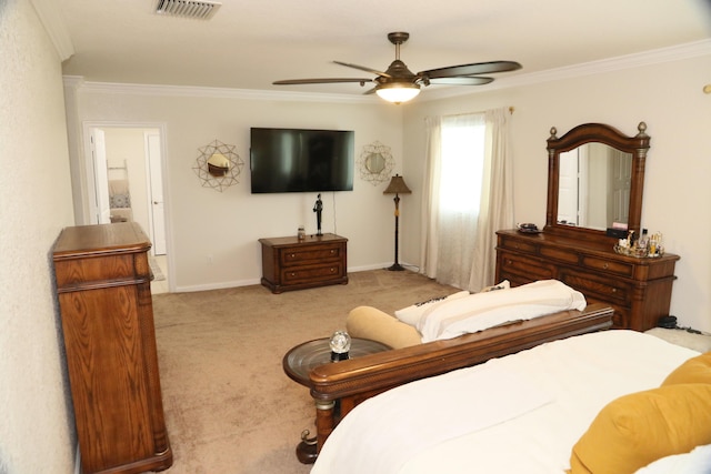 carpeted bedroom featuring ceiling fan and ornamental molding