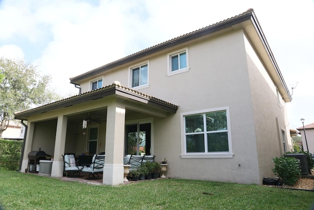 back of property with a yard and cooling unit