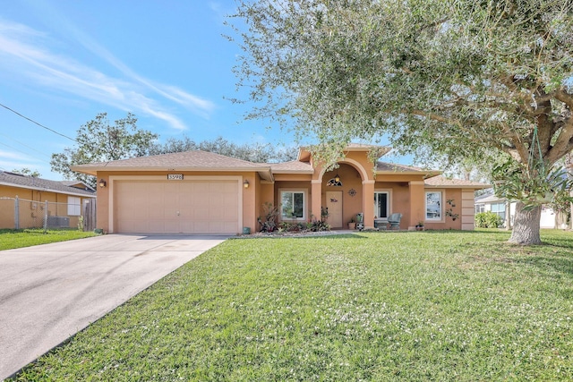 ranch-style home with a front lawn and a garage