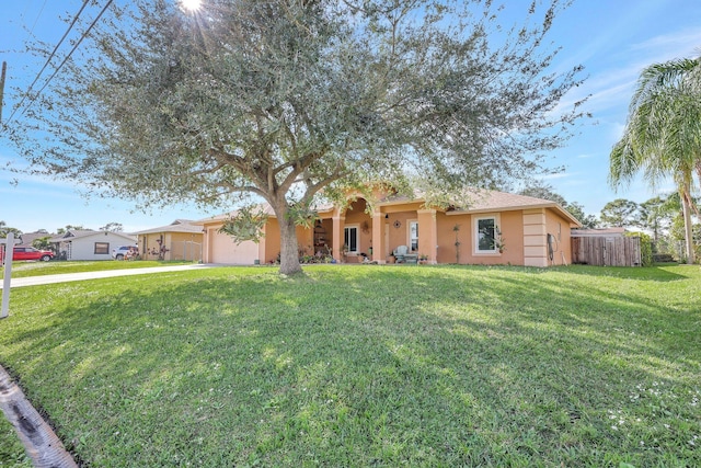 ranch-style house featuring a front lawn and a garage