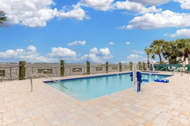 view of swimming pool featuring a patio area