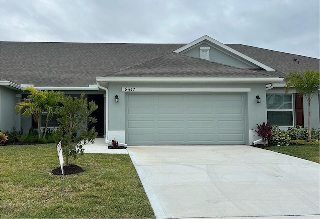 ranch-style house with a front lawn and a garage