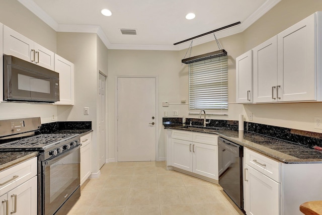 kitchen with white cabinets, sink, dark stone countertops, and black appliances