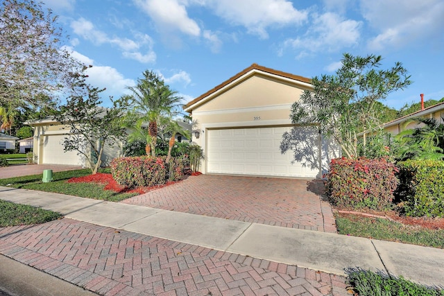 ranch-style house featuring a garage