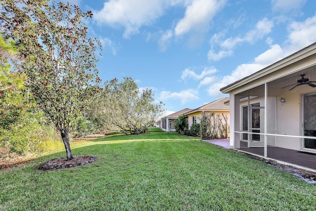 view of yard featuring a sunroom