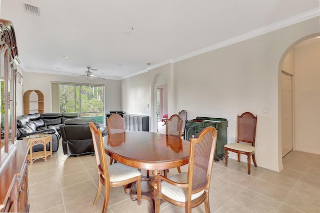 dining room featuring ceiling fan, light tile patterned floors, and ornamental molding