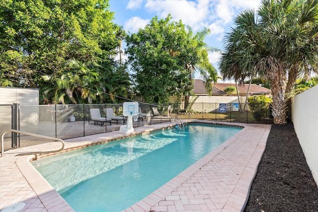 view of swimming pool with a patio