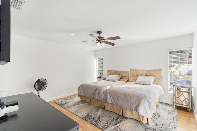 bedroom featuring light wood-type flooring and ceiling fan